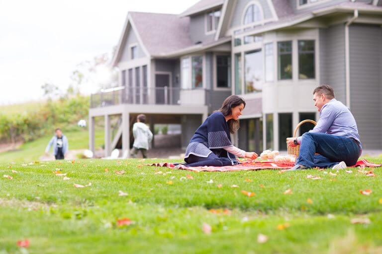 Couple having a picnic at their luxury home in Orono MN