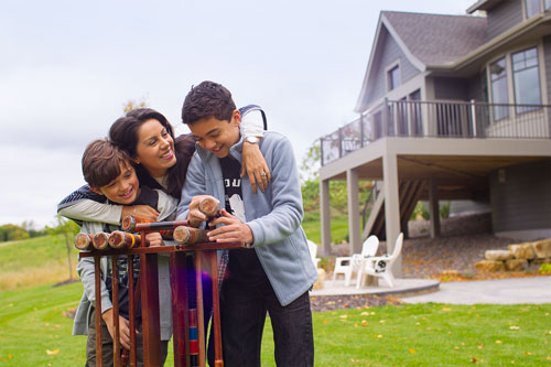 Mother and sons playing at their luxury home in Orono MN