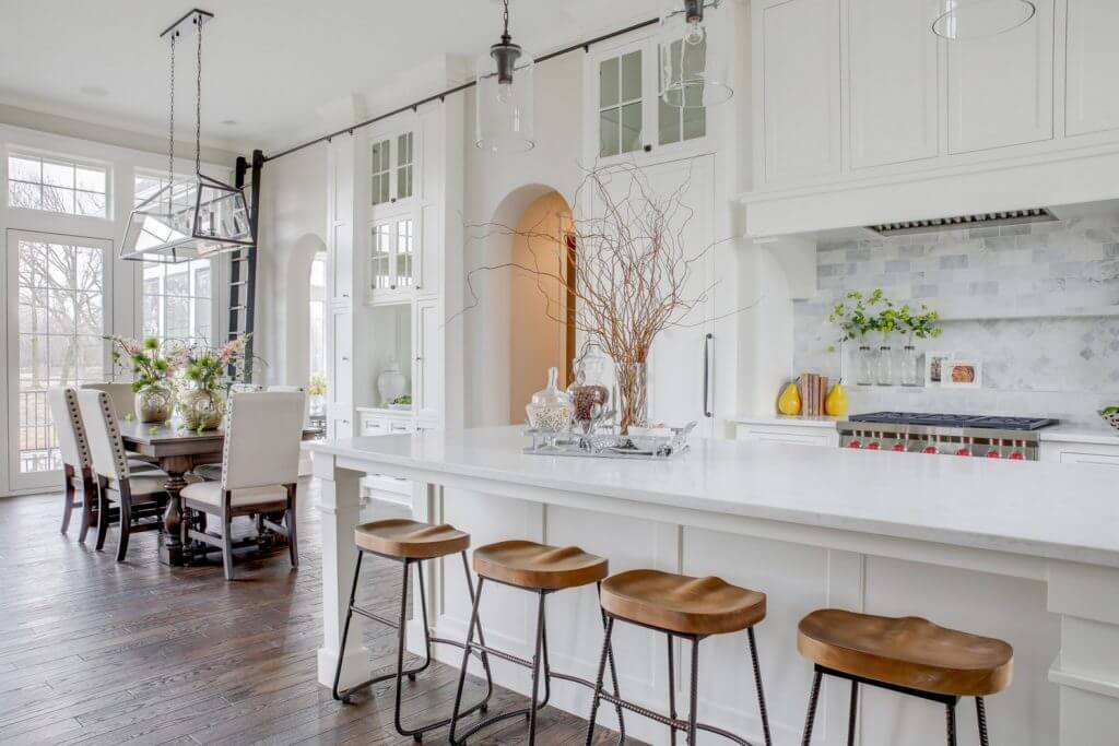 A luxurious white kitchen inside a Lakeview Orono home