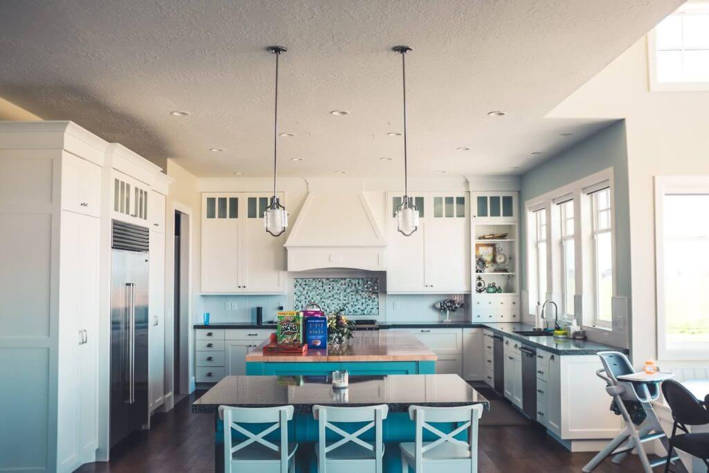 Large kitchen with unique hidden cooking range.